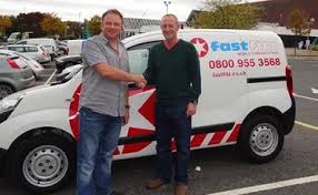 fast fitz franchisor and new franchisee shaking hands infront of a fast fitz van