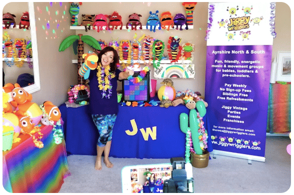 jiggy wrigglers franchisee stood in-front of activity table