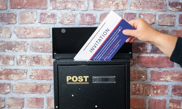 letters being dropped in a post box
