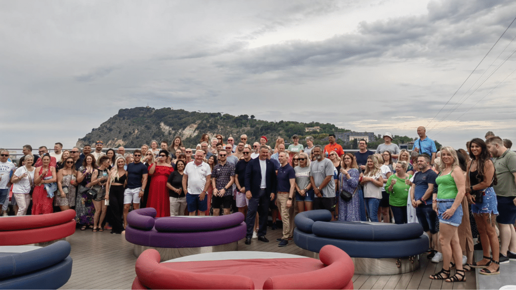 large group of travel franchise franchisees on a cruise ship