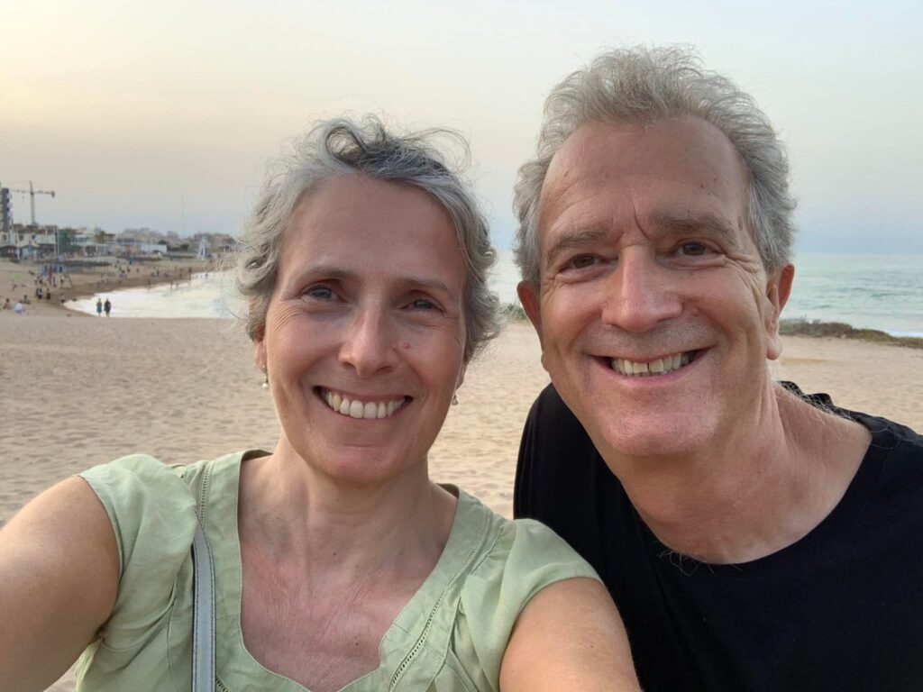 owners Jeff and Jean Drew smiling on the beach
